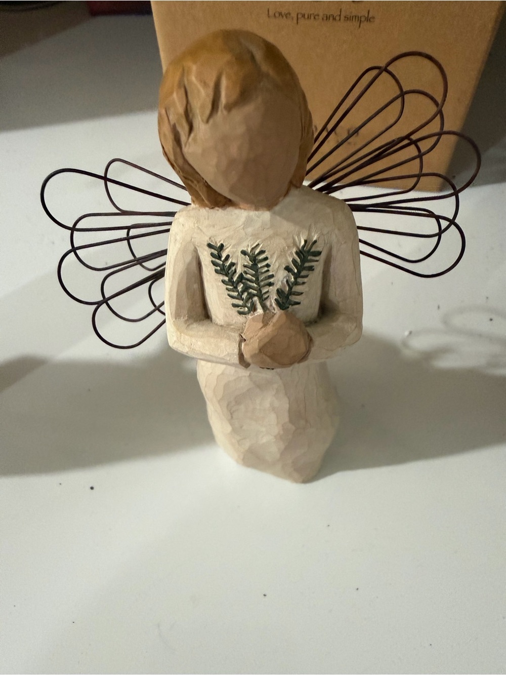 Handcrafted Cream Angel Figurine with Green Accents